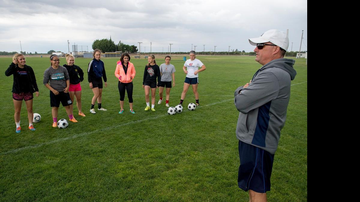 
Modesto Christian girls soccer coach Jason Hardy talks with his team during practice in Salida, Calif., on Thursday, May, 14, 2015. On Monday, Hardy was named the Trans-Valley League Coach of the Year.
