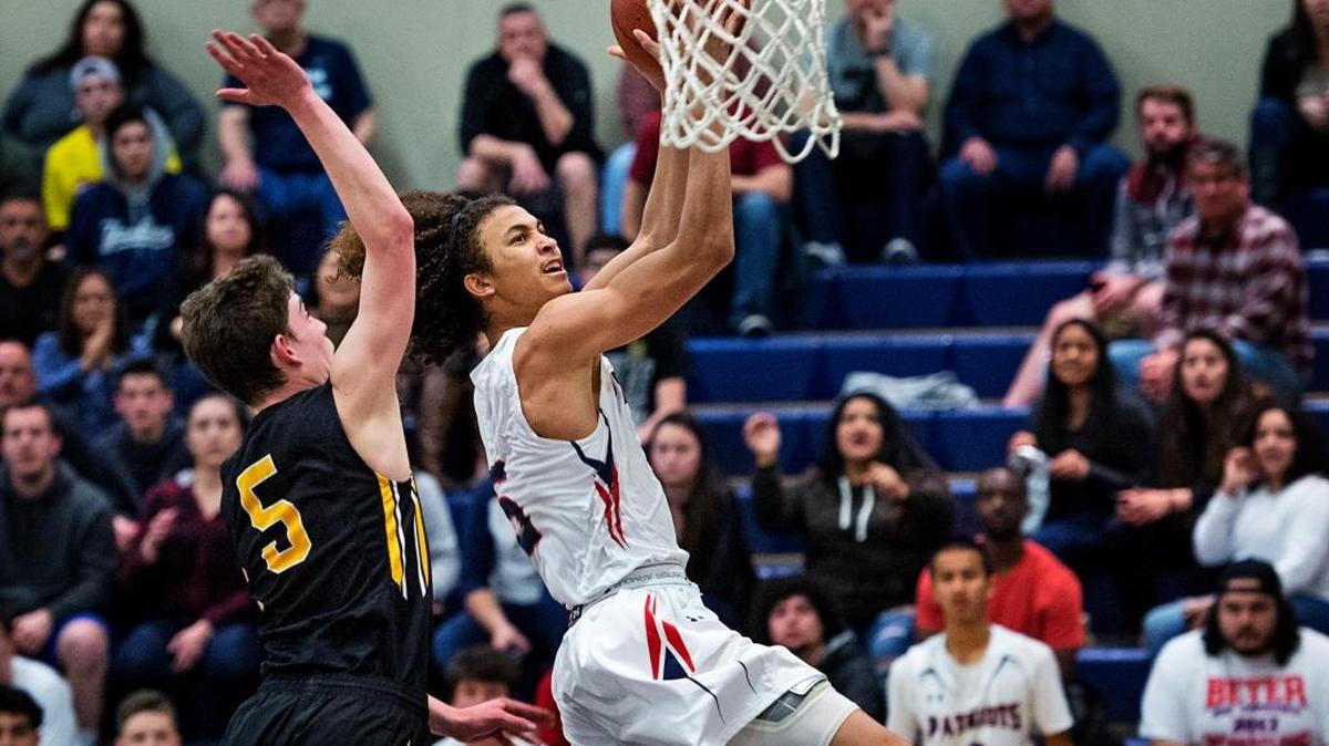 Beyer's Brandon Gray attempts a layup as Mountain View's Adi Paret defends during the CIF Division II Northern California regional boys playoff game at Beyer High School in Modesto, Calif., on Wednesday, March, 8, 2017.