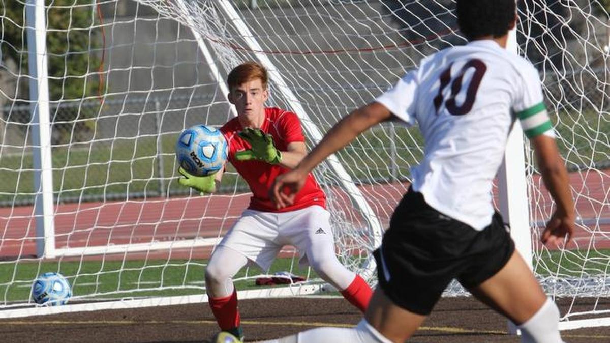 Oakdale goalie Nathan Richardson makes a save on a shot by Weston Ranch striker Joseph Mayorca on Saturday, Nov. 14, 2015, in the Sac-Joaquin Section Division III final in Stagg High in Stockton.