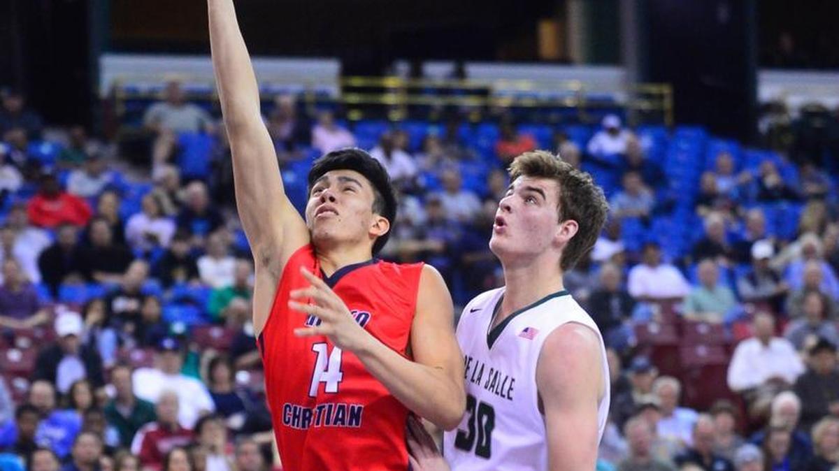 Modesto Christian’s Nico Rojas (11) lays the ball up during the CIF Northern California Open Division Championship where Modesto Christian was defeated by De La Salle 41-40 at Sleep Train Arena in Sacramento California on March 20, 2016.