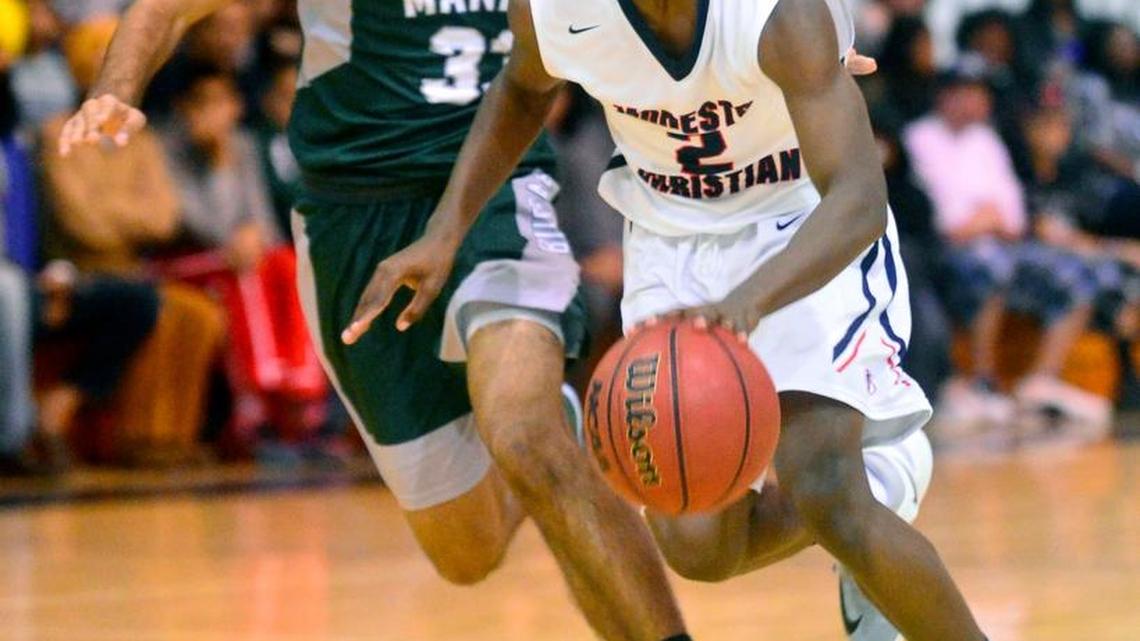 Modesto Christian Michael Pearson (2) drives to the hoop during the 3rd place game where Modesto Christian defeated Manteca 63-48 at the Modesto Christian Hoops Holiday Classic at Modesto Christian High School in Modesto California on December 30, 2016.