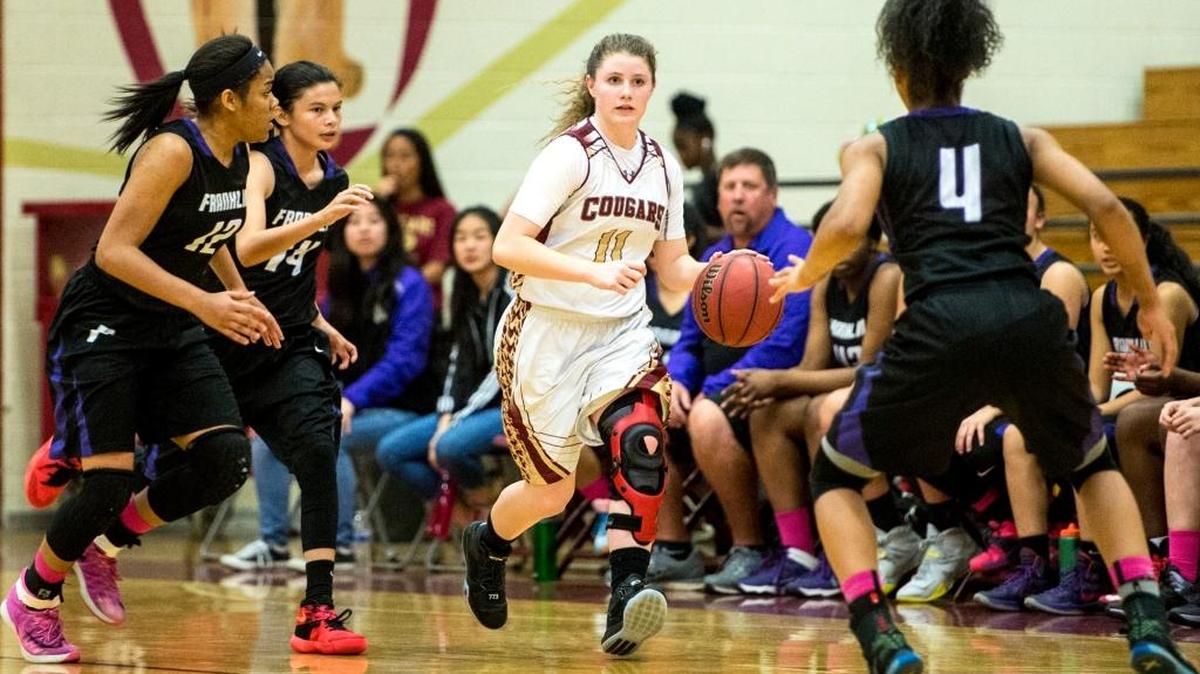 Golden Valley sophomore Delia Moore (11) pushes the ball up the court during a game against Franklin in the first round of the CIF Sac-Joaquin Section Division 1 Playoffs at Golden Valley High School in Merced, Calif., Tuesday, Feb. 23, 2016. The Cougars beat the Wildcats 68-52.