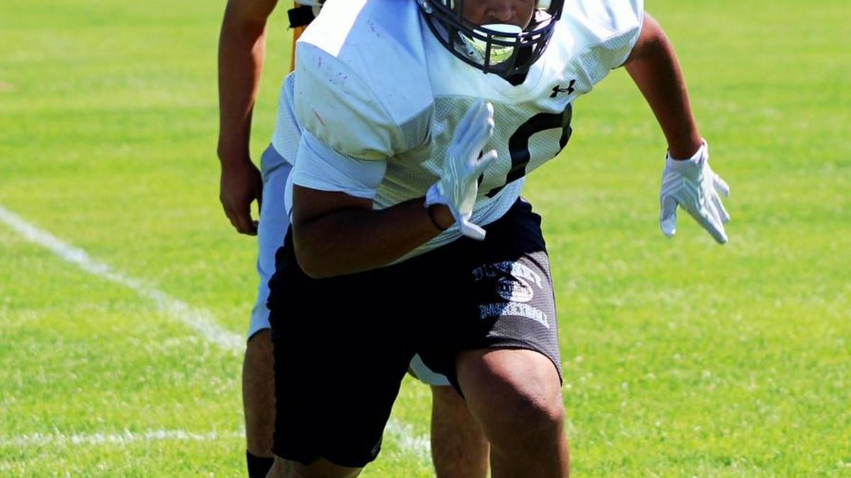 Downey’s Aaric Holt runs through a drill during practice on Tuesday, June 13, 2017, for the Lions All-Star Football Classic on Saturday. Holt will be play linebacker for the South.