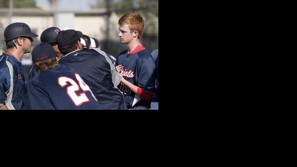 
Beyer pitcher Micah Hall talks with his coaches during the Modesto Metro Conference game with Enochs in Modesto, Calif., on Wednesday, April, 1, 2015. Beyer won the game 8-1.
