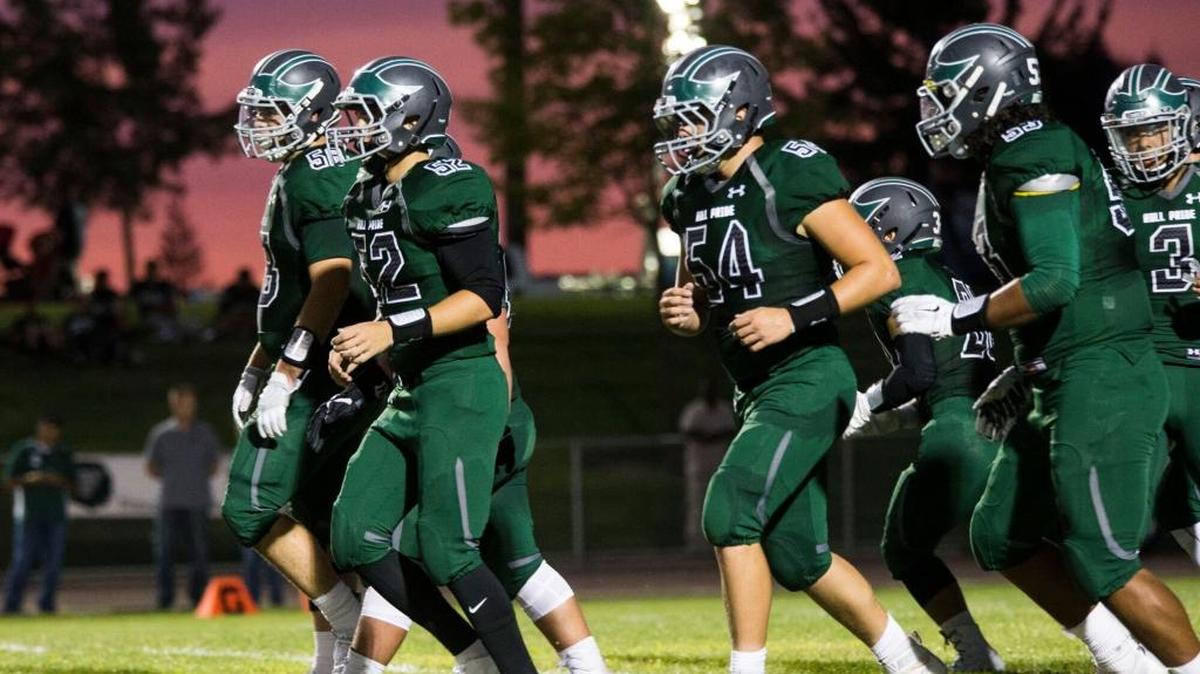 Pitman High players run up to the line during play against Downey High. Downey High vs Pitman High Football Friday August 26th 2016.