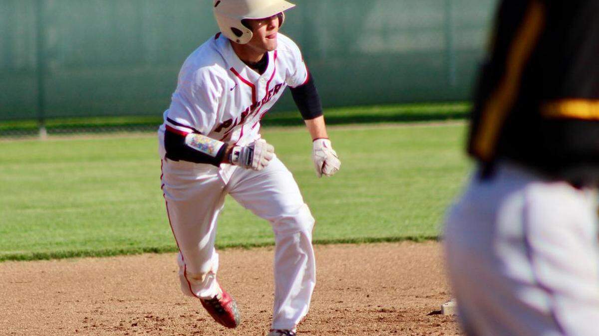 Modesto High's Trent Prokes bolts off the second base bag during the first inning of a game against Hughson in the 49th annual Dick Windemuth Easter Tournament in April.