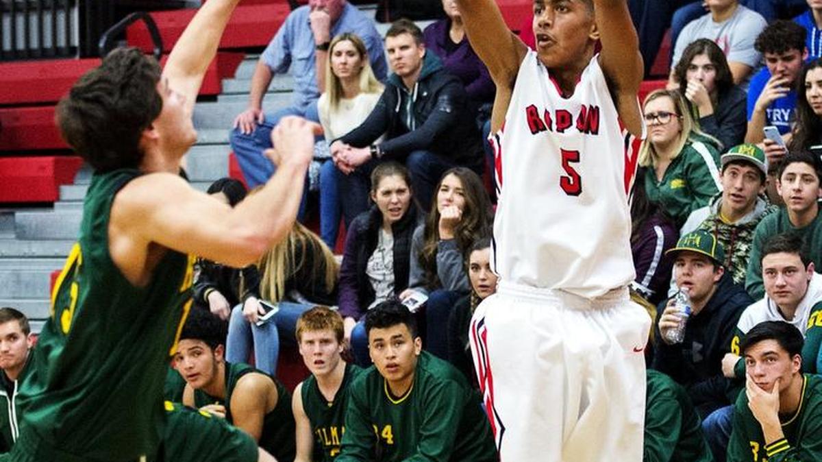 Ripon’s Kyle Sisk launches a three-pointer during the Trans-Valley League game with Hilmar in Ripon, Calif., on Tuesday, Jan. 24, 2017.