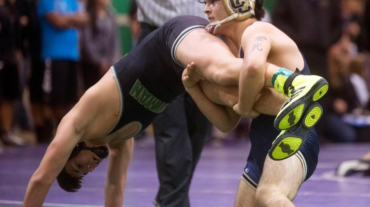 Central Catholic’s Cristian Dominguez grabs Pitman’s Isaiah Perez during the Rumble In The Jungle in Turlock on Jan. 30. Dominguez is The Bee’s Wrestler of the Week.