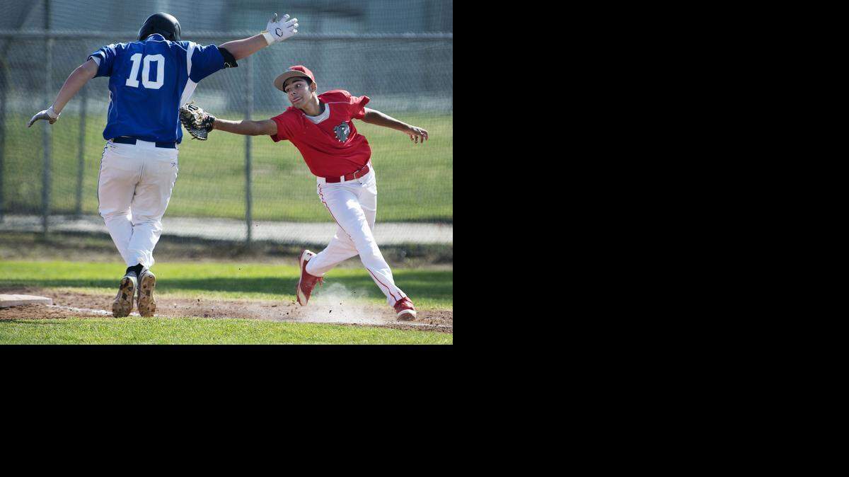 
Ceres first baseman Haaydn Martinez tries to tag Brookside Christian’s Jared Holzer after being pulled off the bag and during Thursday’s championship game.
