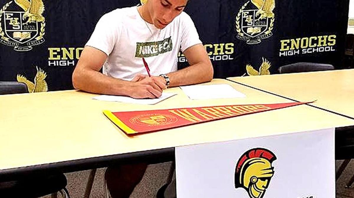 Enochs senior Christian Kiryakous signs his letter of intent for Stanislaus State, where he'll play soccer and study beginning in the fall. Kiryakous is the first boys soccer player from Enochs to receive a Division I or II scholarship.