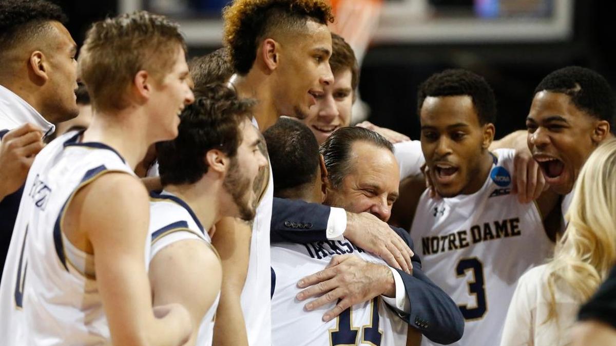 Notre Dame head coach Mike Brey embraces guard Demetrius Jackson (11) after Notre Dame defeated Stephen F. Austin 76-75 in a second-round NCAA men’s college basketball tournament game Sunday, March 20, 2016, in New York.