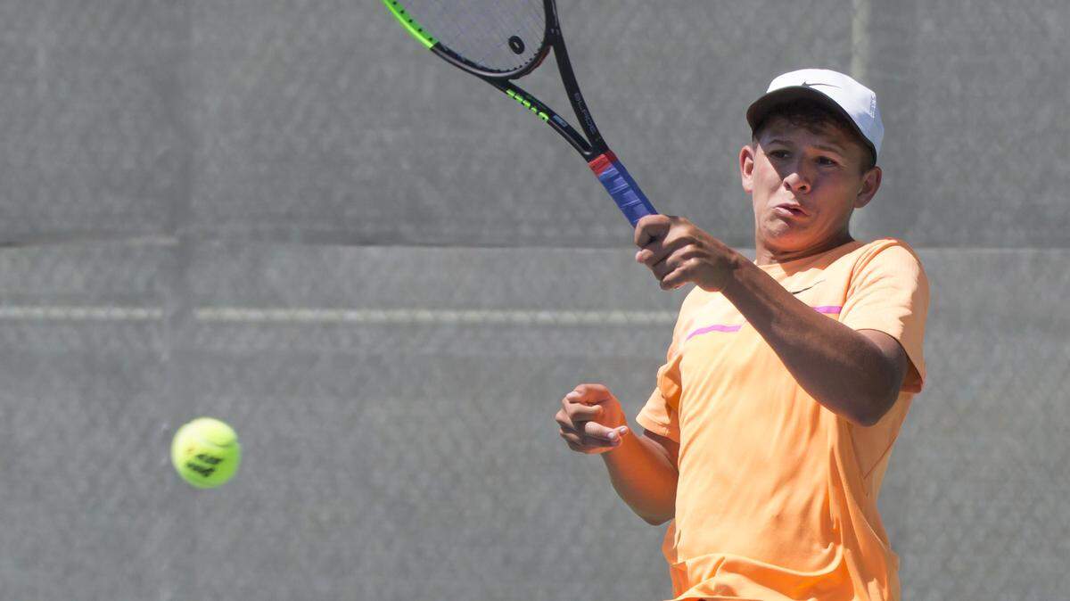Modesto High's Coby McCaig hits a forehand during the Sac-Joaquin Section Division I tennis tournament at the Johnson Ranch Racquet Club in Roseville. McCaig defeated Folsom's Sean Barstow in the final, 6-2 and 6-4, winning his second section title in three years.