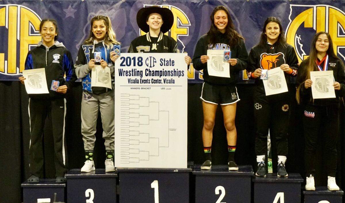 Enochs High senior Rory Coscia (center) won the 116-pound weight class at the CIF State Girls Wrestling Championships on Saturday, Feb. 24, 2018, in Visalia. Coscia closed her high school career with two consecutive state titles, four consecutive state medals, and a career record of 128-9.