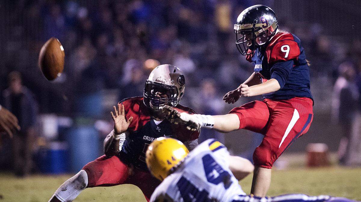 Modesto Christian place kicker Rachel Smith kicks an extra point during the Trans Valley League game with Escalon at Modesto Christian High School  in Modesto, Calif., on Friday, October 28, 2016.