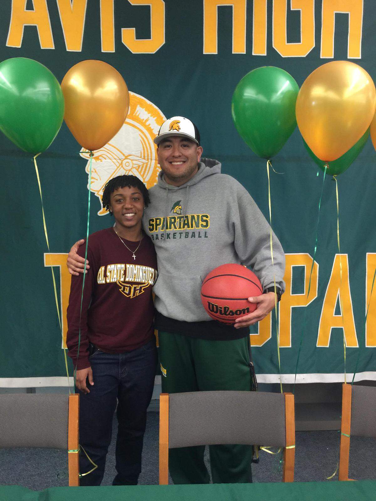 Grace Davis High senior Lea Anderson signed her national letter of intent to play basketball at Cal State University, Dominguez Hills, on Monday, Feb. 5, 2018. Anderson was joined at the head table by family and athletic director and coach Tim Garcia (pictured).