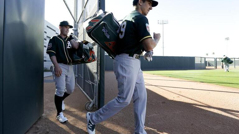 Gallery: A's pitchers, catchers hold first spring training practice
