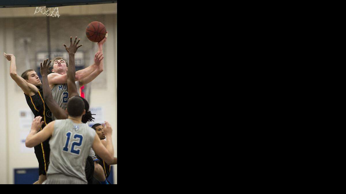 
MJC forward Joe Hamilton scores two during the Big 8 Conference game with Sacramento City at Modesto Junior College in Modesto on Friday, January, 9, 2015. MJC won the game 66-61.
