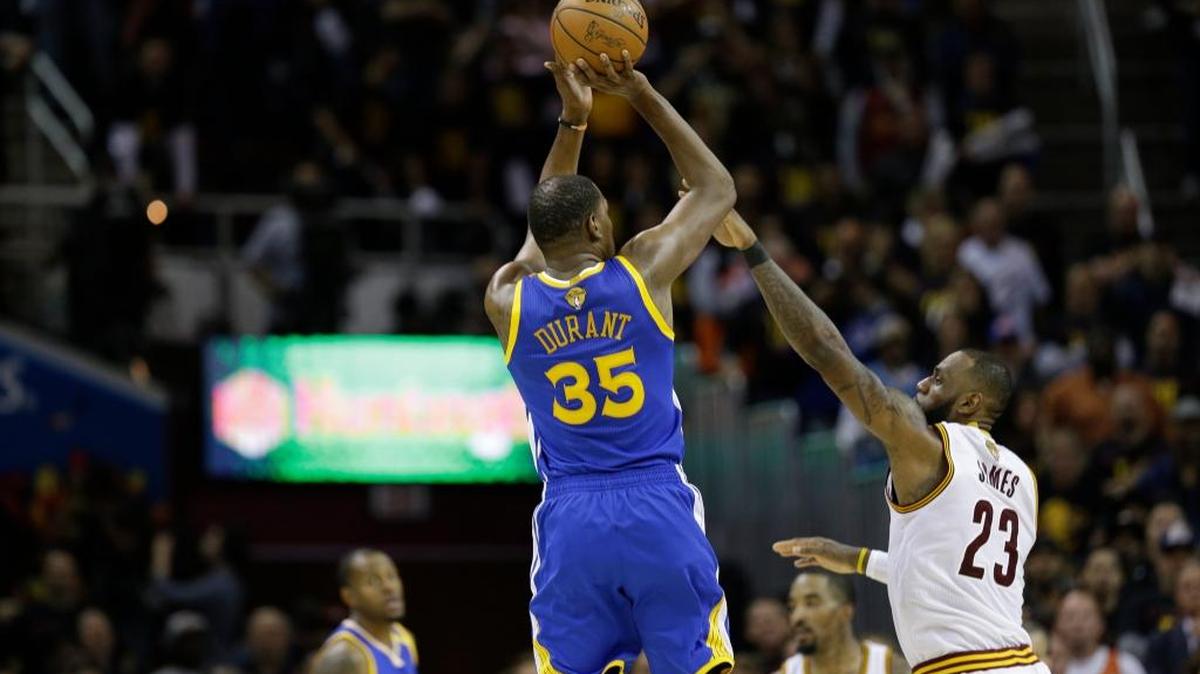 Golden State Warriors forward Kevin Durant shoots over Cleveland Cavaliers forward LeBron James during the second half of Game 3 of the NBA Finals in Cleveland, Wednesday, June 7, 2017. The Warriors won 118-113 to take a 3-0 lead in the best-of-seven series.