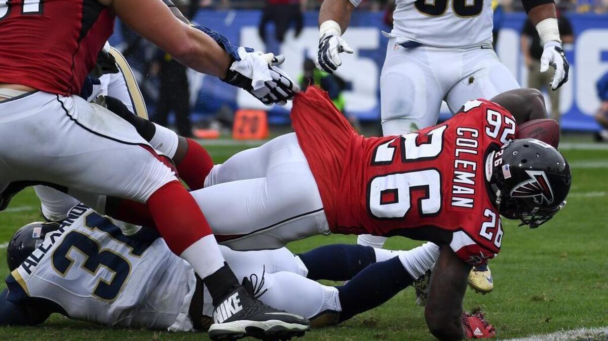 9. ATLANTA FALCONS (7-5) – Last week’s ranking: 9. Won 42-14 vs. Rams. Next: vs. 49ers. Atlanta Falcons running back Tevin Coleman scores over Los Angeles Rams free safety Maurice Alexander during the first half of an NFL football game Sunday, Dec. 11, 2016, in Los Angeles.