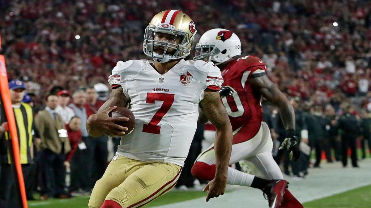 San Francisco 49ers quarterback Colin Kaepernick (7) runs for a touchdown as Arizona Cardinals outside linebacker Deone Bucannon (20) defends during the second half of an NFL football game, Sunday, Nov. 13, 2016, in Glendale, Ariz. (AP Photo/Rick Scuteri)
