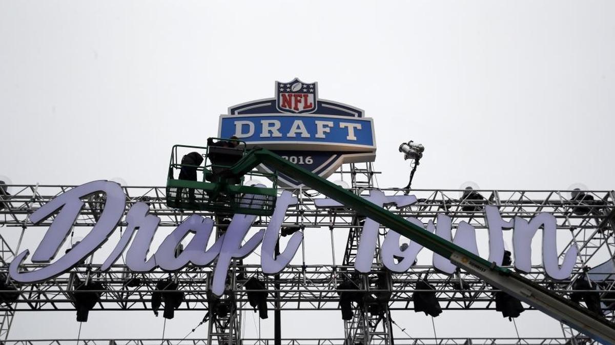 Workers prepare for NFL’s Draft Town at Grant Park in advance of the 2016 draft of college players, which begins Thursday, April 28, 2016.