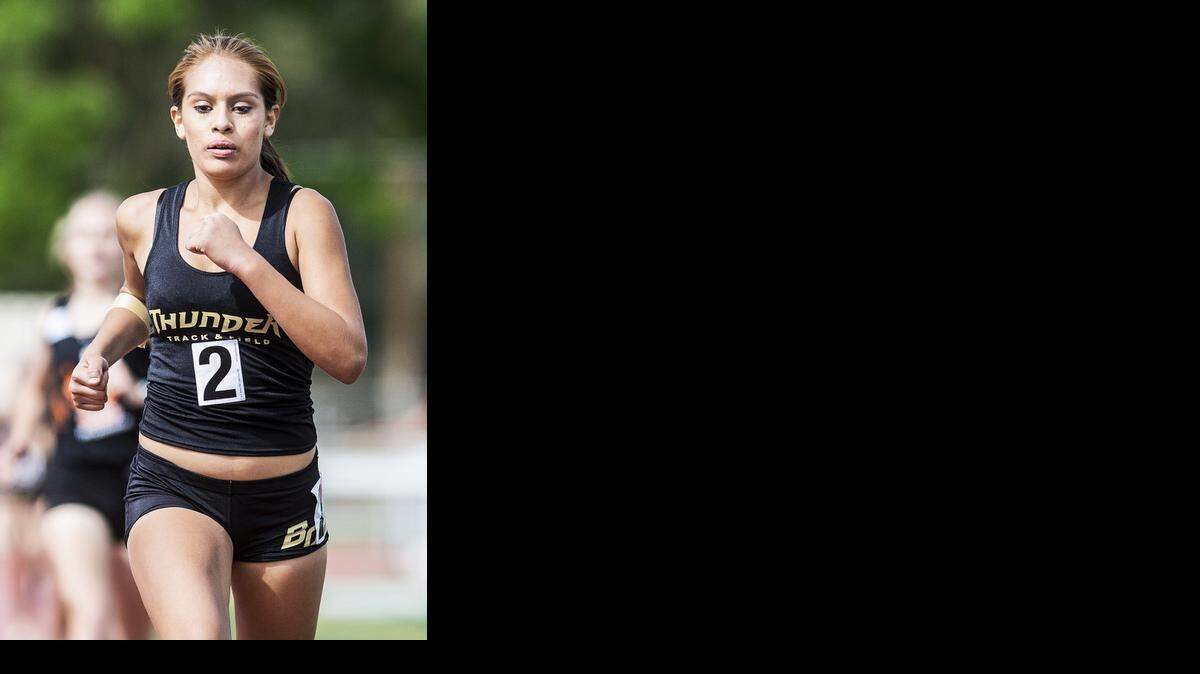
Buhach Colony sophomore Kaitlen Acevedo competes in the girls 800-meter run during the Central California Conference Center Meet at Veterans Stadium at Golden Valley High School in Merced, Calif., Wednesday, April 1, 2015.
