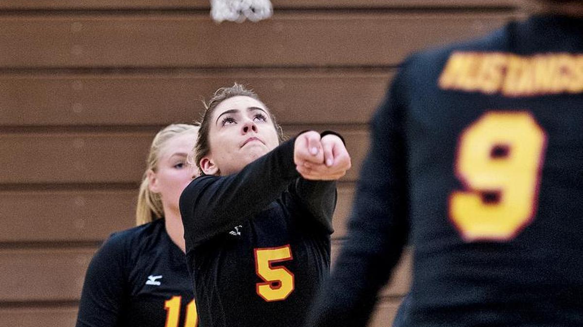 Oakdale’s Kailee Whorton sets the ball for her teammates during the Valley Oak League match with Central Catholic in Oakdale, Calif., on Wednesday, September 28, 2016.