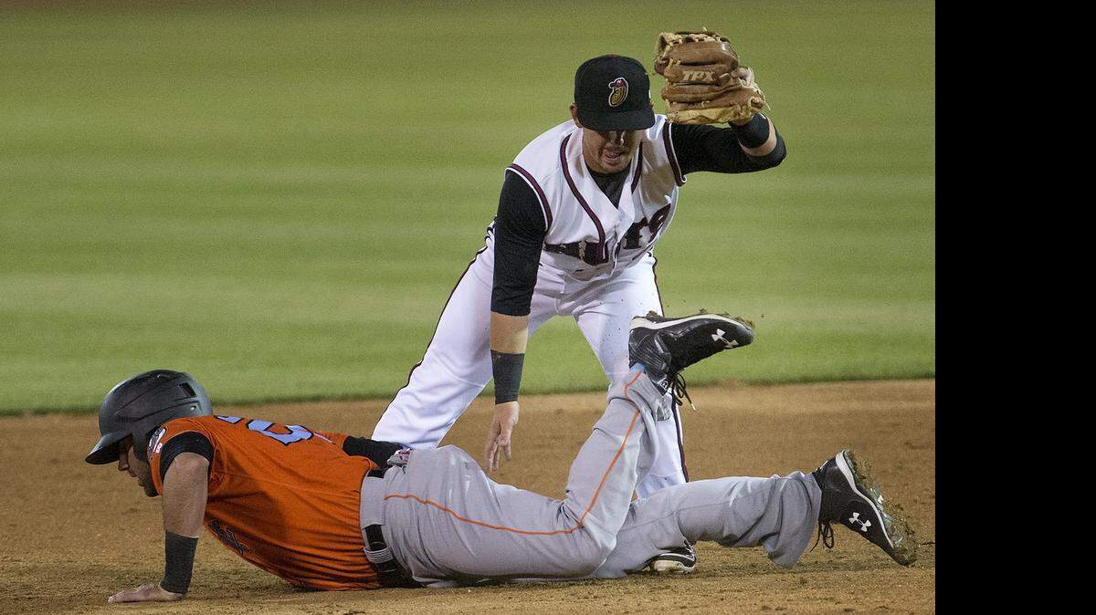 
Nuts shortstop Zach Osborne, above, takes a throw from pitcher Johendi Jiminian to pick off the 66ers’ Kaleb Cowart Thursday. 
