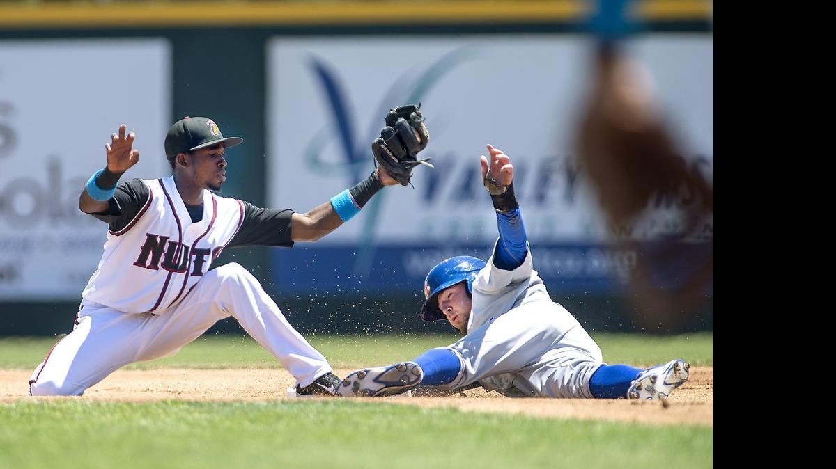 
Stockton's J.P. Sportman slides past the tag of the Modesto Nuts second baseman Wilson Soriano during the California League game at john Thurman Field in Modesto, Calif., on Sunday, June, 7, 2015. The Nuts won the game 5-1.
