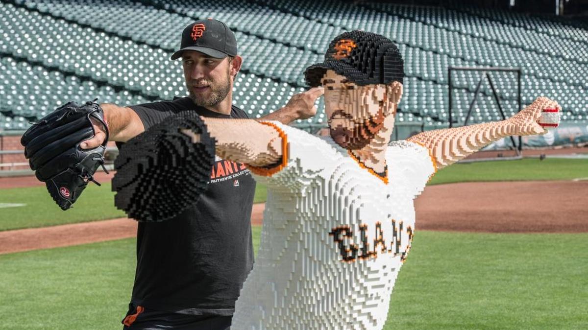 San Francisco Giants pitcher Madison Bumgarner mirrors his life-size LEGO likeness at the mound before the game at AT&T Park in San Francisco on Saturday, July 30, 2016. Made from more than 36,000 bricks, the model took LEGO Master Builders 300 hours to design and build.