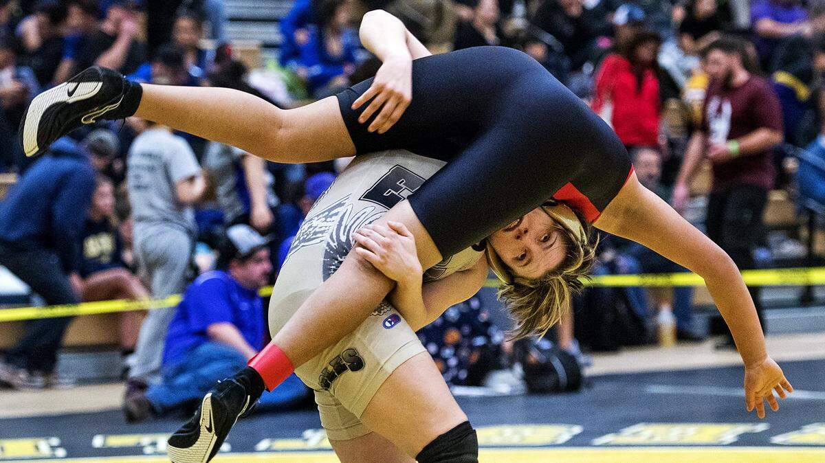 Enochs 121-pound wrestler Rory Coscia flips Lincoln's Katherine Hayden during the Lady Eagles Wrestling Tournament at Enochs High School in Modesto on Saturday, Jan. 21, 2017. Coscia pinned Hayden for the victory.