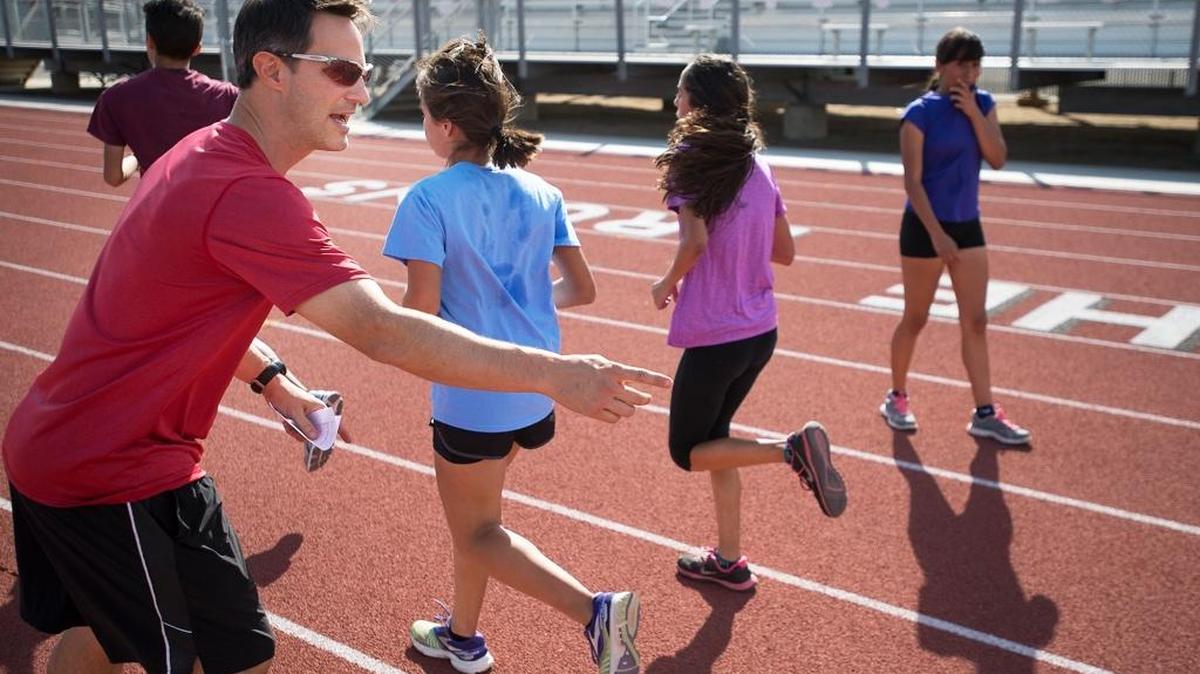 
Riverbank cross country coach Monte Wood calls out times as runners work out at practice at Riverbank on Tuesday.

