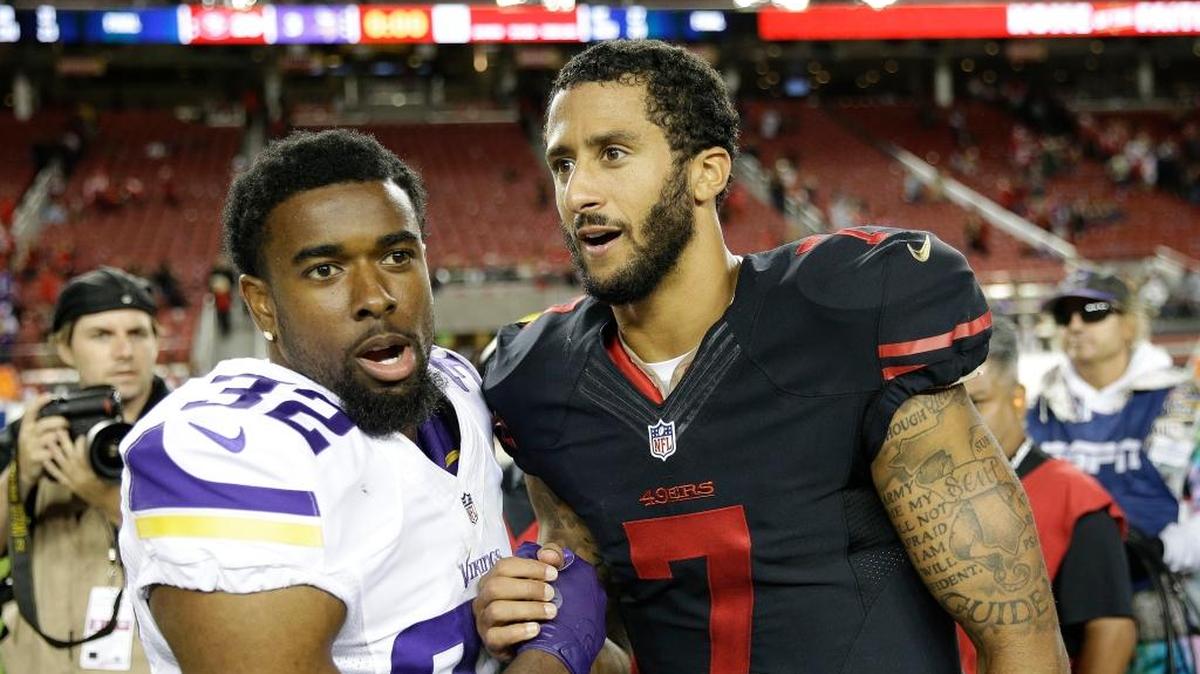 Minnesota Vikings cornerback Antone Exum (32) greets San Francisco 49ers quarterback Colin Kaepernick (7) after an NFL football game in Santa Clara, Calif., Monday, Sept. 14, 2015. (AP Photo/Marcio Jose Sanchez)