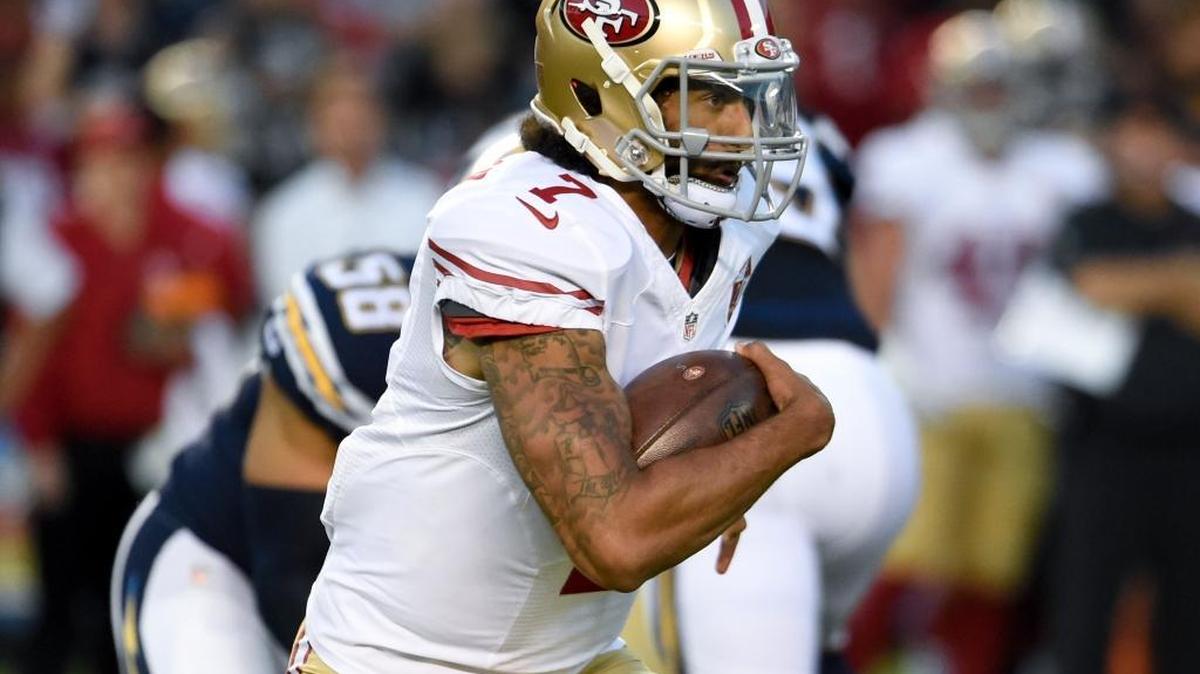 Quarterback Colin Kaepernick runs against the San Diego Chargers on Sept. 1 during a preseason game. Making the switch at quarterback from Blaine Gabbert to Kaepernick won't dramatically change the offense for the San Francisco 49ers. The hope for the 49ers is it will change results.