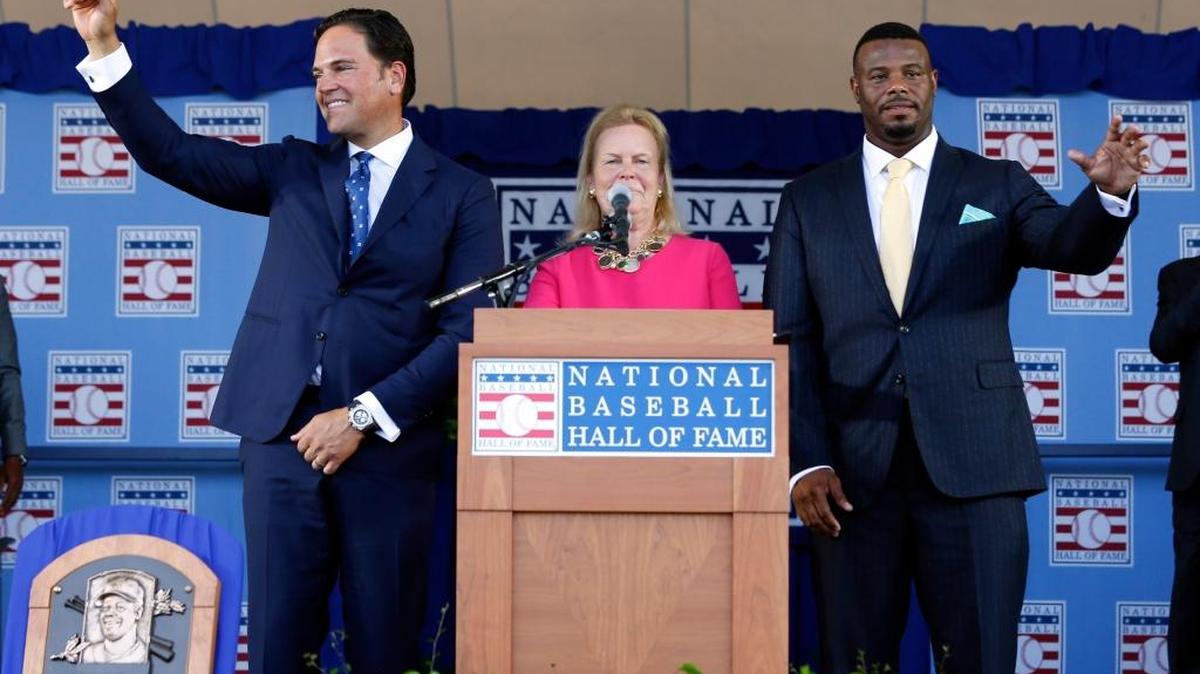 National Baseball Hall of Fame inductees Mike Piazza, left, and Ken Griffey Jr. stand with hall Chairman Jane Forbes Clark at the conclusion of the induction ceremony at Clark Sports Center on Sunday, July 24, 2016, in Cooperstown, N.Y.