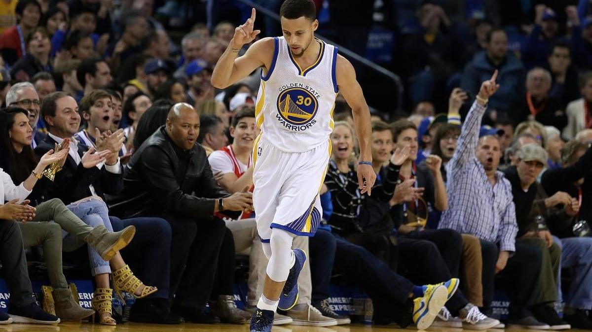 The Warriors' Stephen Curry celebrates a score against the Portland Trail Blazers on Friday, March 11, 2016, in Oakland.
