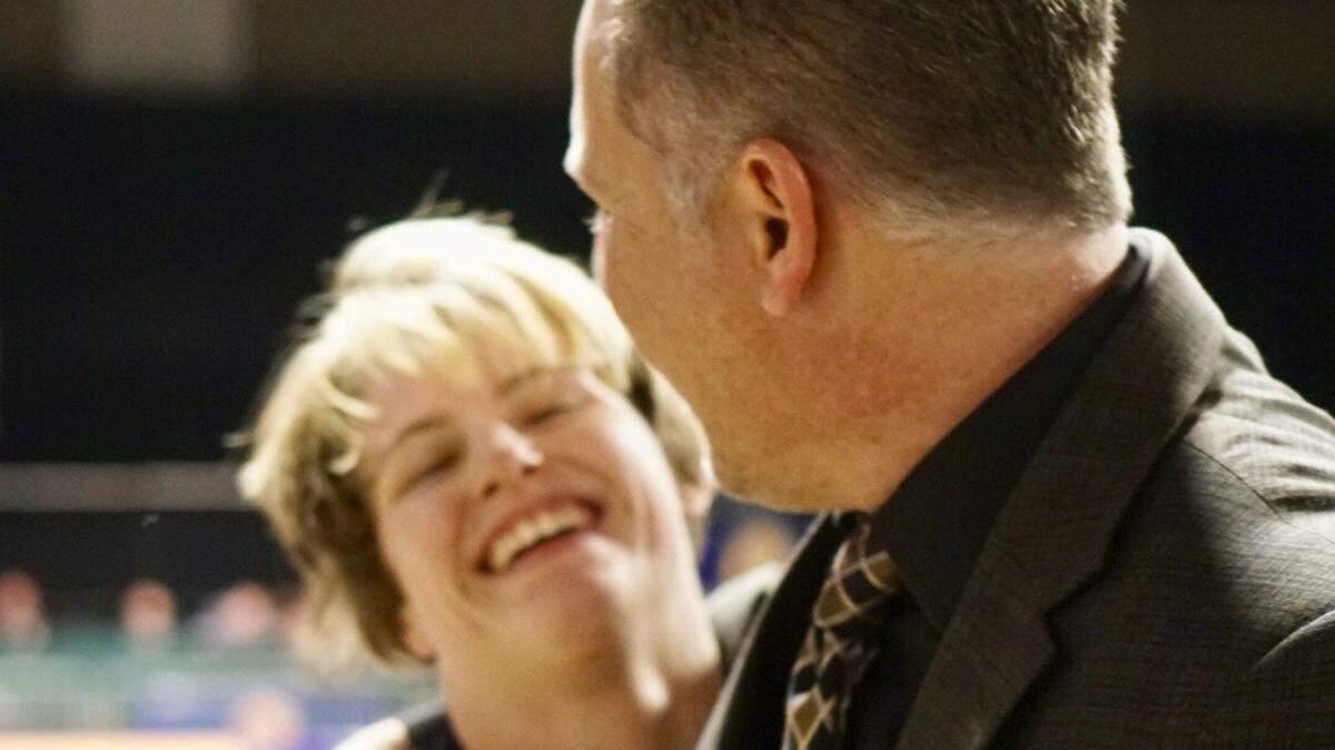 Enochs High senior Rory Coscia (left) is congratulated by coach Duane Brooks after winning the 116-pound title at the CIF State Girls Wrestling Championships on Saturday, Feb. 24, 2018, in Visalia.