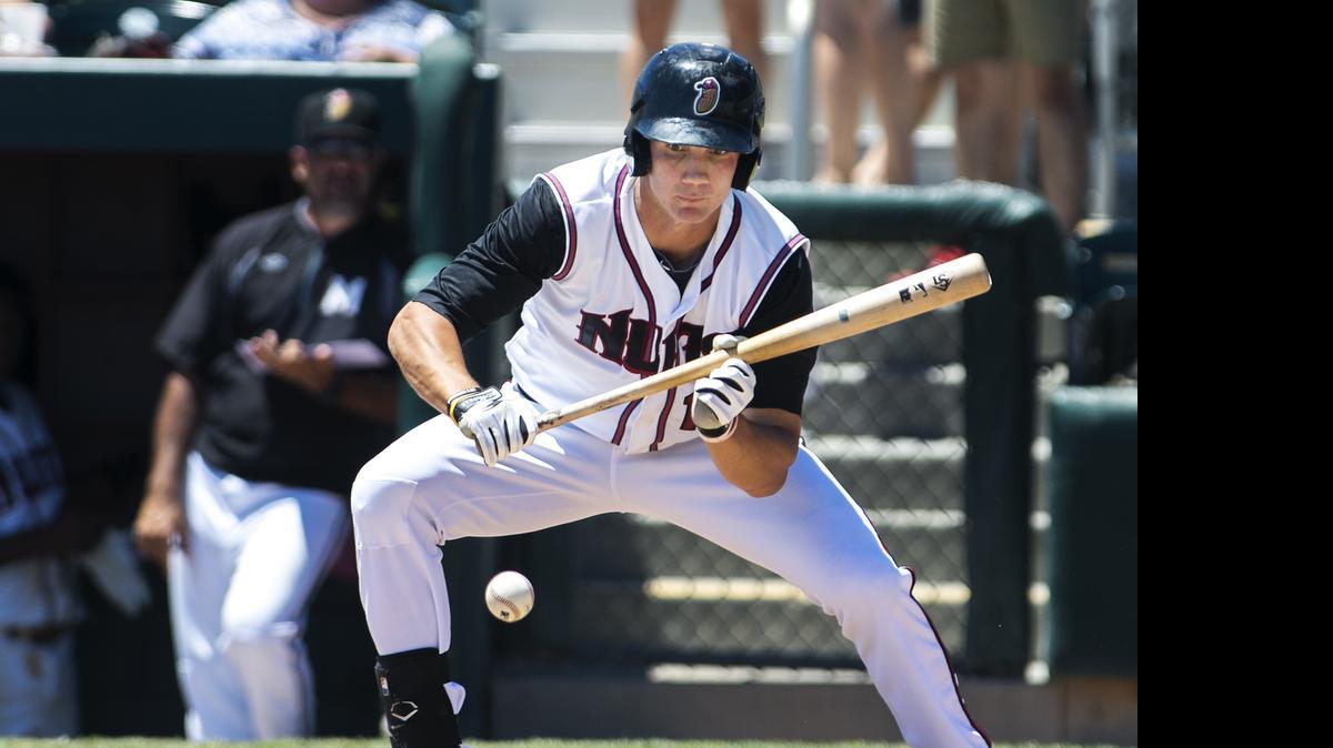 
The Nuts’ Jordan Patterson lays down a bunt for an infield single in the third inning during Sunday’s loss to the Mavericks. 
