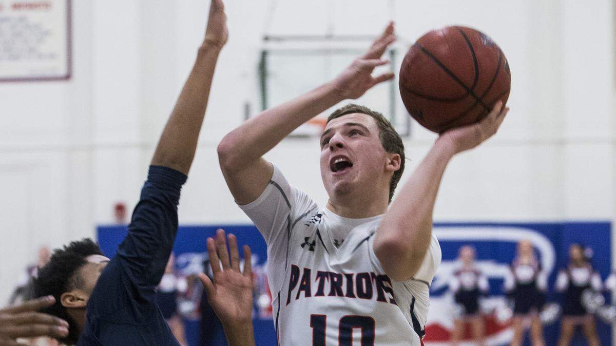 Ben Polack (10) of Beyer High go to the hoop and drives through a Modesto Christian player. Modesto Christian traveled to Beyer High in Modesto Monday, Jan. 23, 2017.