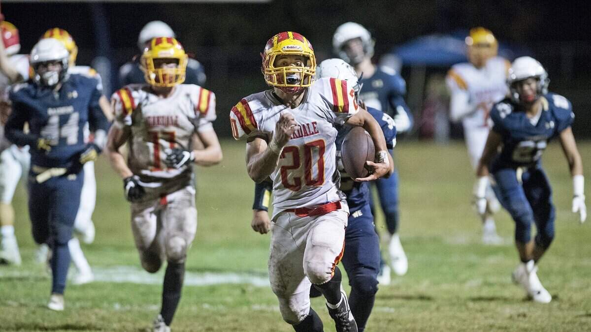 Oakdale's Cameron Cherry breaks free for a 44-yard fourth quarter touchdown run to give Oakdale the 27-21 lead over Central Catholic during the Valley Oak League game at Central Catholic High School in Modesto, Calif., on Friday, Nov. 3, 2017.