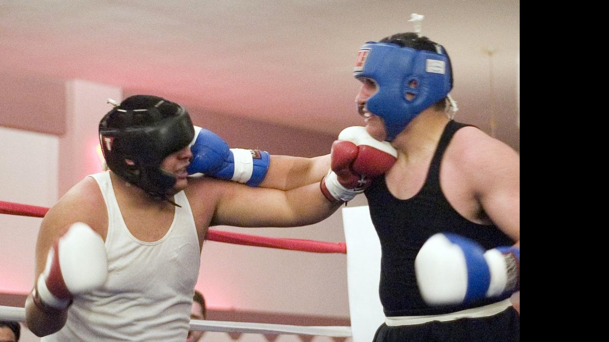 
Rodney Hernandez, right, battles Jesse Hernandez in an amateur bout in 2006 in Modesto. Rodney Hernandez won, a triumph he hopes to repeat in tonight's Big Knockout Boxing heavyweight title fight.


