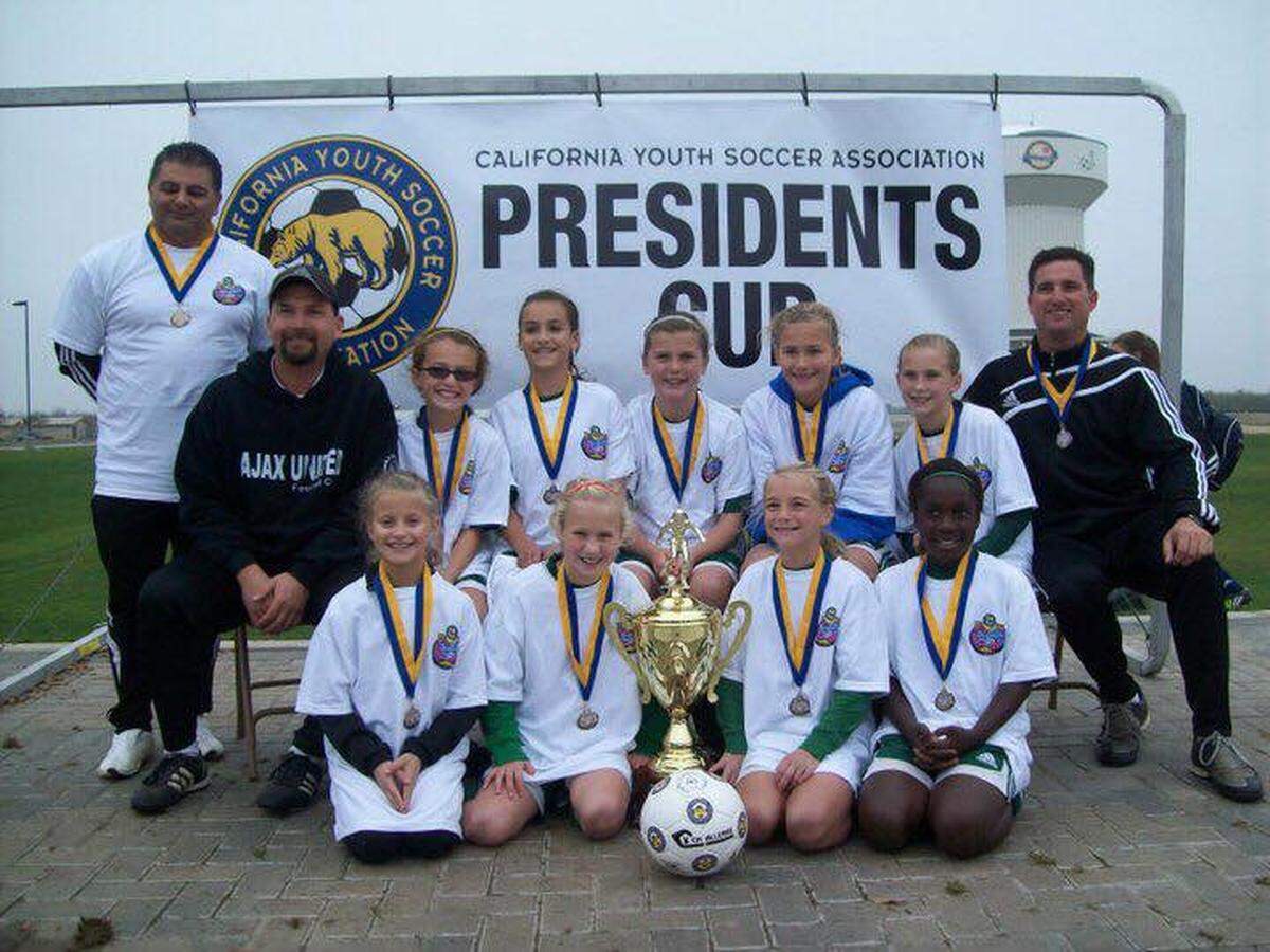 Gregori High assistant girls soccer coach Luke Molthen, seated second from the left, died Tuesday, Jan. 23, of a heart attack just hours befor the Jaguars' showdown with Modesto Metro Conference rival Enochs. Molthen, shown here coaching with the Modesto Ajax at The Presidents Cup, was 50.